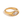 Gold ring with a clear gemstone on a white background