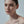 Close-up of a woman's face with a neutral background