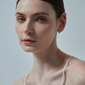 Close-up of a woman's face with a neutral background