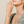 Woman wearing a bracelet with a neutral background