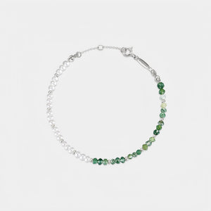 Bracelet with green beads and silver chain on a white background