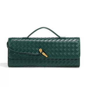Green woven handbag with a gold clasp on a white background