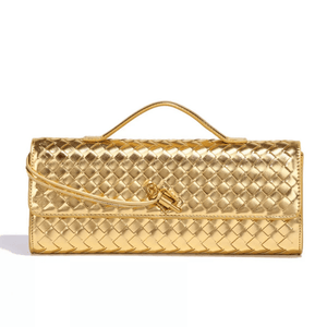 Gold woven handbag on a white background