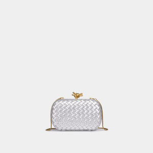 Silver woven handbag with a gold clasp on a white background