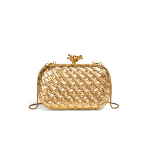 Gold woven handbag on a white background
