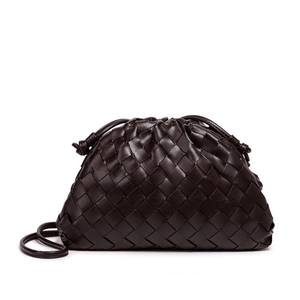 Brown woven handbag on a white background