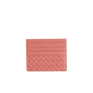 Pink cardholder with woven pattern on a white background