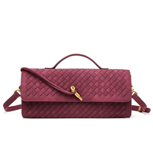 Maroon woven handbag with gold accents on a white background