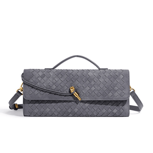 Gray woven handbag with gold clasp on a white background