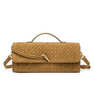 Brown woven handbag with a gold clasp on a white background