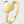 Gold heart-shaped ring with a diamond on a light gray background