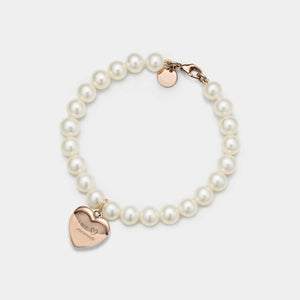 Pearl bracelet with a rose gold heart-shaped locket on a white background