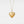 Gold heart-shaped locket with 'I love Permade' engraving on a light gray background