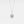 A gold-plated necklace with a heart-shaped charm, featuring a custom photo projection on the charm.