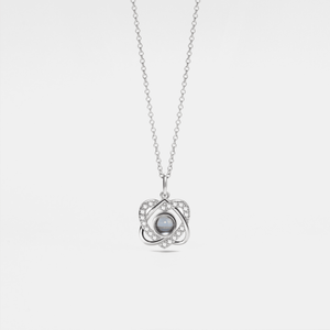 A gold-plated necklace with a heart-shaped charm, featuring a custom photo projection on the charm.