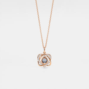 A gold-plated necklace with a heart-shaped charm, featuring a custom photo projection on the charm.