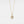 Gold necklace with a heart-shaped pendant on a light gray background