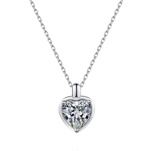 Heart-shaped diamond pendant on a chain against a white background