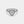 Heart-shaped diamond ring on a light gray background