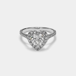 Heart-shaped diamond ring on a light gray background