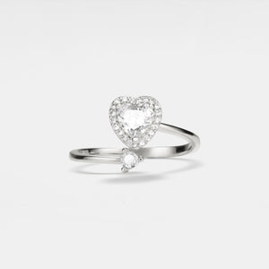 A gold-plated bypass ring with a heart-shaped design featuring cubic zirconia, set on a solid sterling silver band.