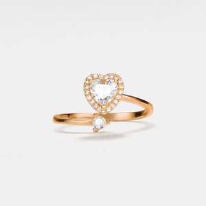 A gold-plated bypass ring with a heart-shaped design featuring cubic zirconia, set on a solid sterling silver band.