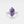 A gold-plated cocktail ring with a hexagon-shaped amethyst crystal set on a white background.