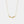 Gold feather necklace on a light gray background