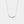 Silver feather necklace on a light gray background
