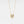 Gold necklace with a pendant on a light gray background