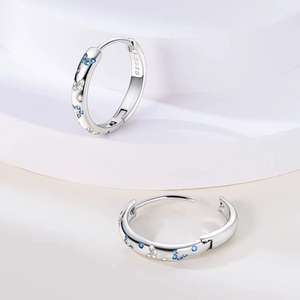 Blue and clear cz butterfly huggie hoop earrings in 925 sterling silver with polished finish and hinged closure