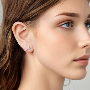 Model wearing sterling silver poodle stud earrings with pavé-set clear stones