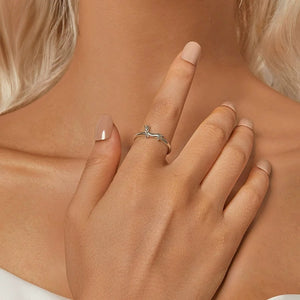 Model wearing a silver ring with a dachshund dog design