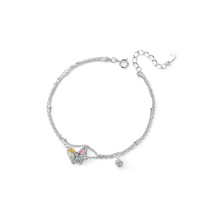Silver bracelet with butterfly charms on a white background