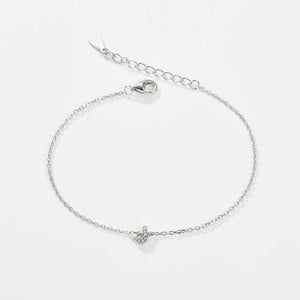 A sterling silver adjustable chain bracelet with a lobster clasp closure, featuring a hypoallergenic finish and gold plating.