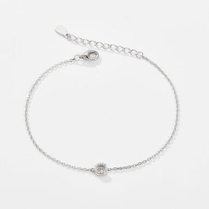 A sterling silver adjustable chain bracelet with a lobster clasp closure, featuring a hypoallergenic finish and gold plating.