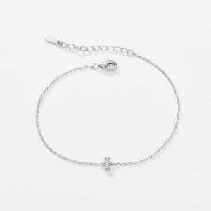 A sterling silver adjustable chain bracelet with a lobster clasp closure, featuring a hypoallergenic finish and gold plating.