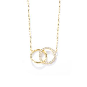 Gold necklace with interlocking rings on a white background