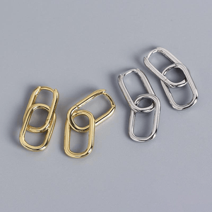 Gold and silver metal loops on a gray background