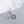 Silver chain-style earrings on a light gray background