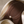 Pearl necklace on a brown fabric background
