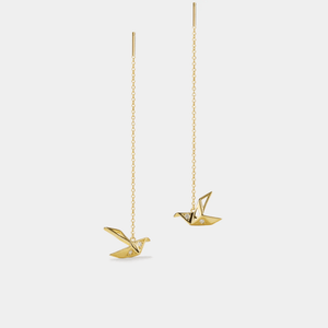 A pair of gold-plated origami crane threader stud earrings made of sterling silver with cubic zirconia.