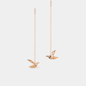 A pair of gold-plated origami crane threader stud earrings made of sterling silver with cubic zirconia.