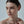 Close-up of a woman's face with a neutral background