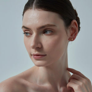 Close-up of a woman's face with a neutral background