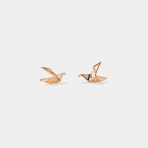 A pair of gold-plated origami crane threader stud earrings made of sterling silver with cubic zirconia.
