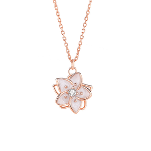 Rose gold necklace with a pink floral pendant on a white background