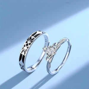 Two silver rings with intricate designs on a light blue background