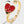 Gold ring with a red heart-shaped design on a white background