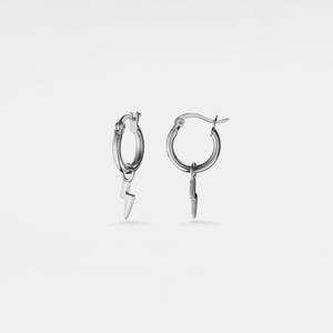Silver hoop earrings with lightning bolt charms on a light gray background